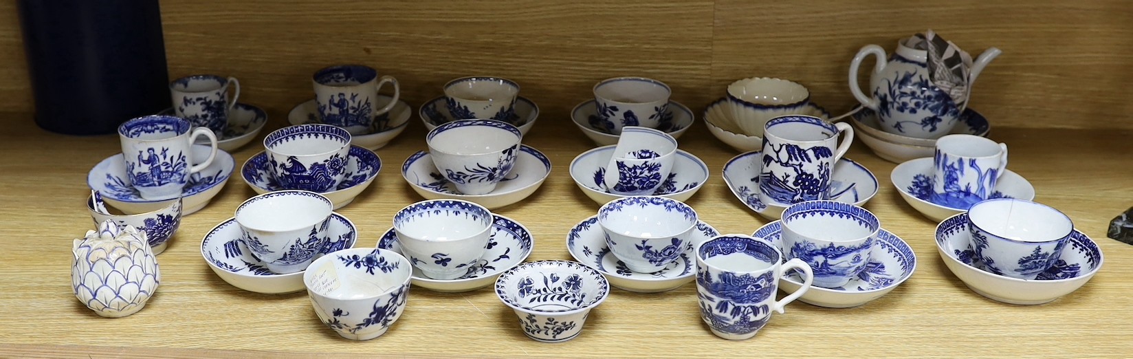 A large group of 18th century Worcester, Caughley and Liverpool blue and white tea bowls, coffee cups and saucers etc. including a Bow Cross-Legged Man